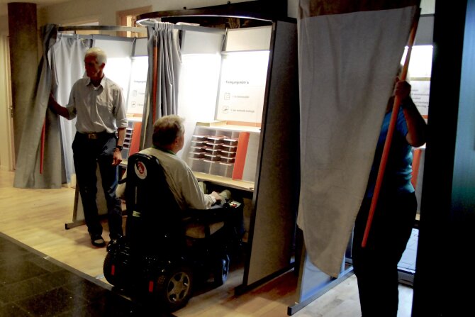Wheelchair user in election booth