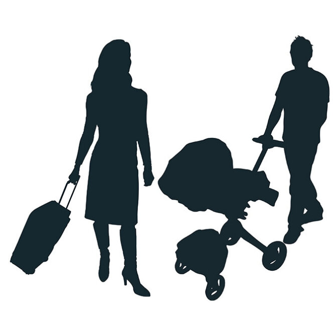 Silhouette of a traveling woman and a man with strolley