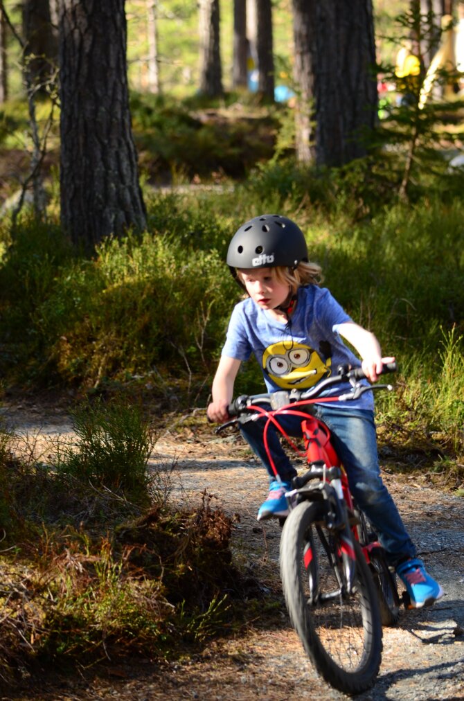 Child participating in bicycle race in the park