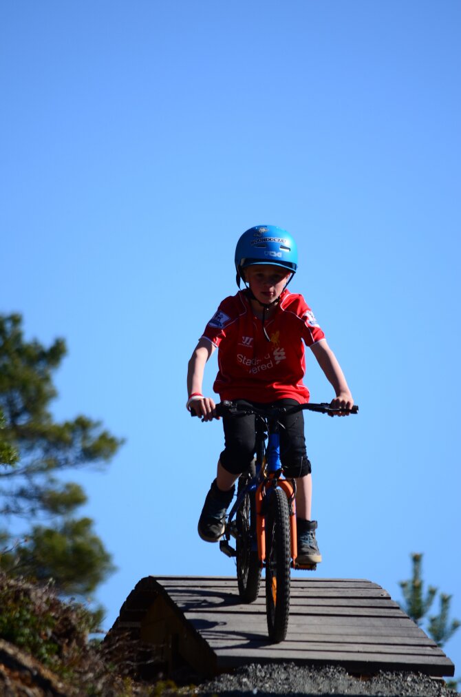 Child participating in bicycle race in the park