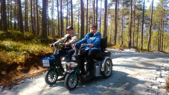 An old married couple out with their scooters